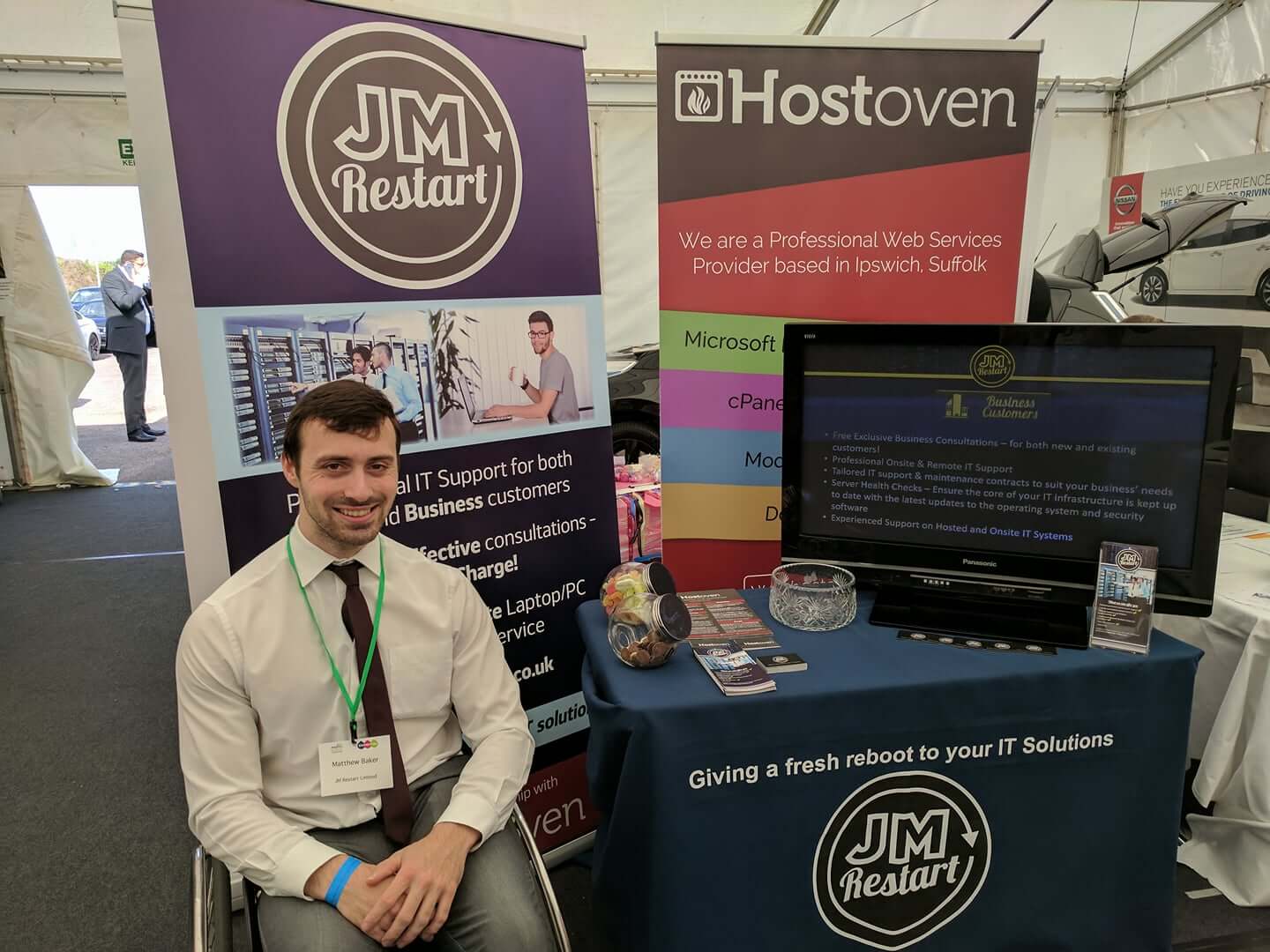 Managing Director Matthew Baker with JM Restart's stand at the Anglia Business Exhibition 2017