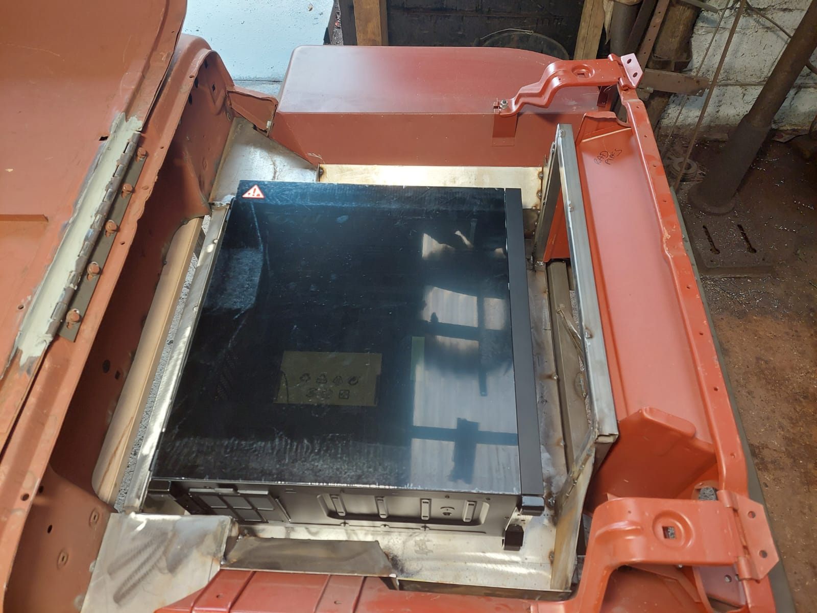 Computer case mounted within the open bonnet area of a Willys Jeep custom PC project